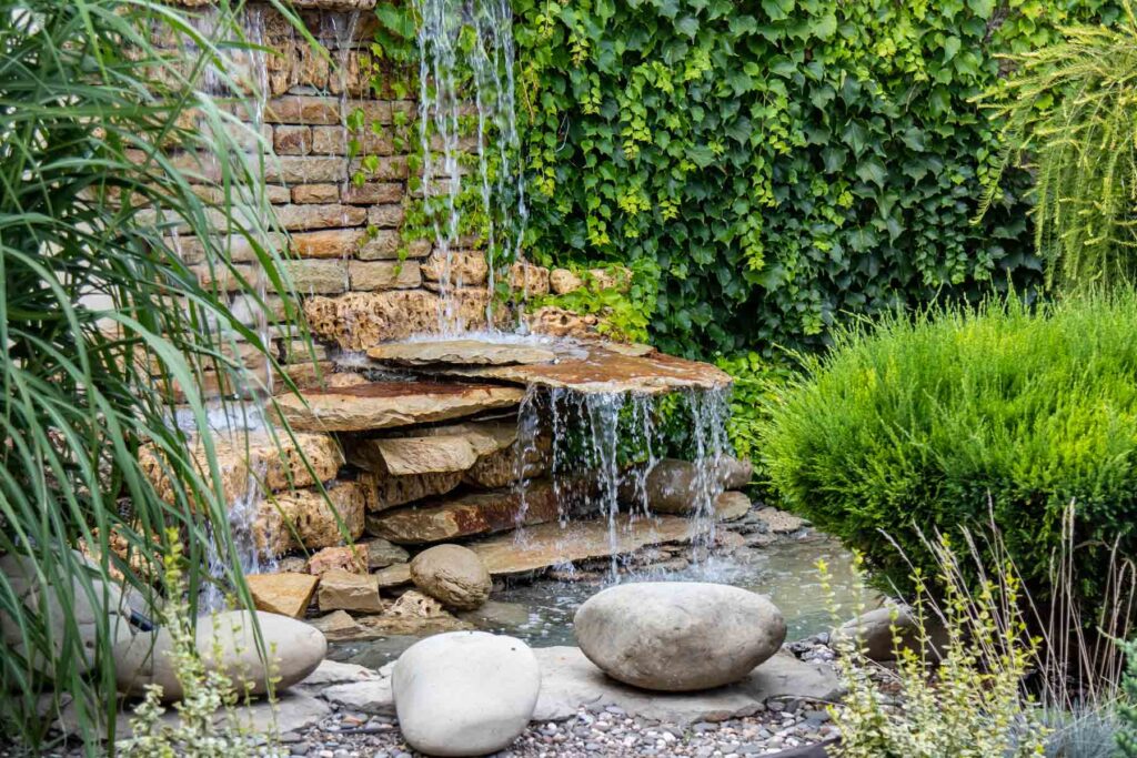 custom backyard waterfall installation in San Jose residential landscape